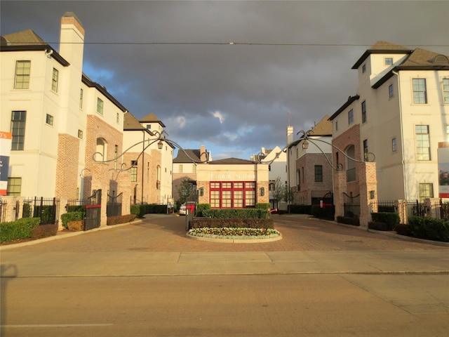 exterior space featuring fence and a residential view