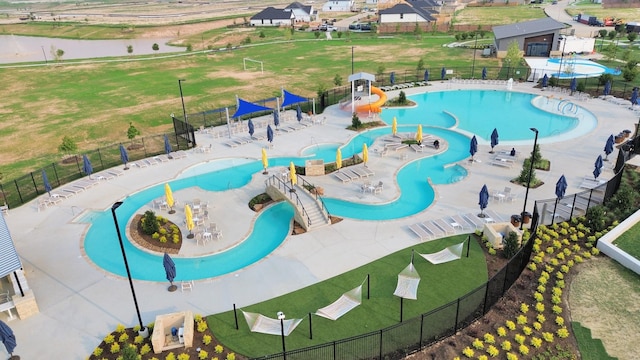 27010 Costa Creek Dr, Katy, TX 77493 - pool featuring a yard, fence, and a water slide
