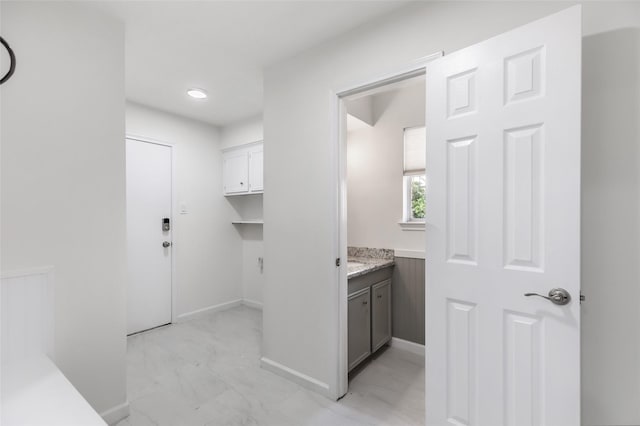 bathroom with baseboards and vanity