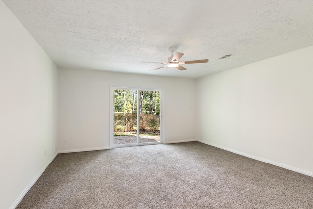 carpeted empty room featuring baseboards, a ceiling fan, a textured ceiling, and visible vents