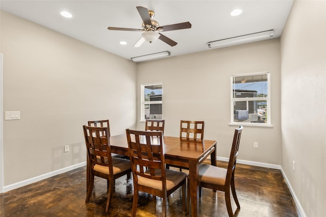 dining area with recessed lighting, baseboards, and concrete flooring