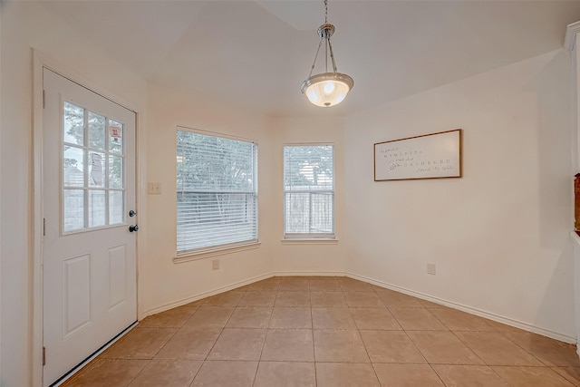 25910 Palmdale Estate Dr, Richmond, TX 77406 - unfurnished dining area with light tile patterned floors and baseboards