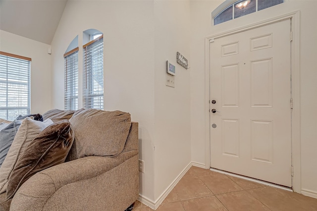 25910 Palmdale Estate Dr, Richmond, TX 77406 - foyer entrance featuring light tile patterned floors, baseboards, and vaulted ceiling