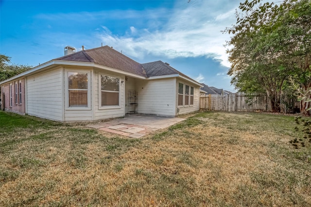 25910 Palmdale Estate Dr, Richmond, TX 77406 - rear view of property with a yard, a patio area, and fence