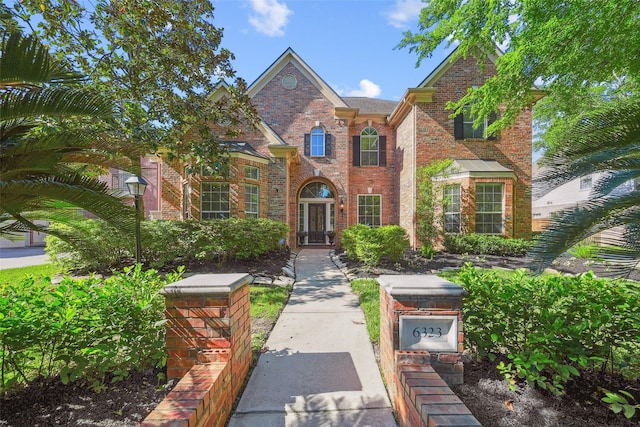 traditional home featuring brick siding