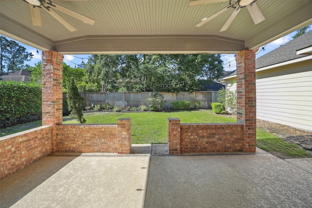 view of patio with a fenced backyard and ceiling fan