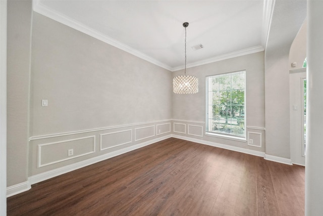 unfurnished dining area featuring dark wood-type flooring, visible vents, crown molding, and a notable chandelier