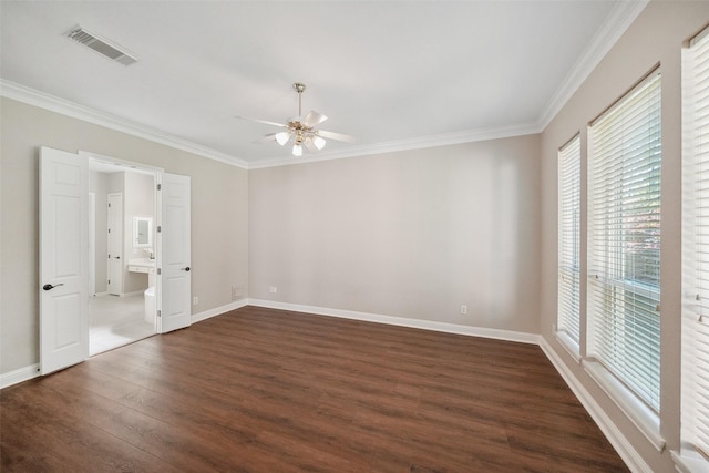 unfurnished bedroom with visible vents, crown molding, dark wood-style floors, and multiple windows
