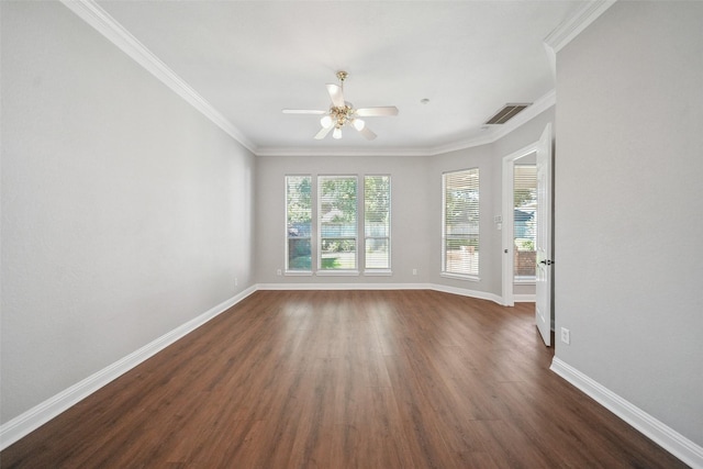 empty room with visible vents, dark wood-type flooring, crown molding, baseboards, and ceiling fan