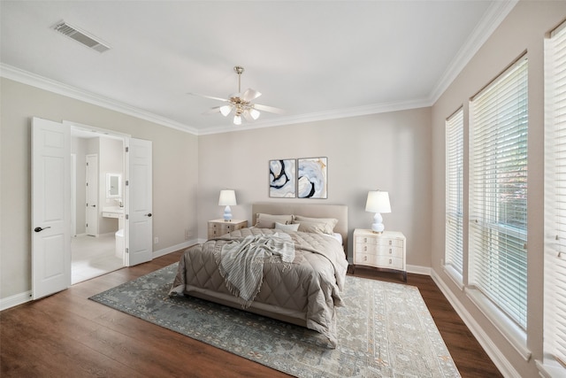 bedroom featuring baseboards, visible vents, dark wood-type flooring, and crown molding
