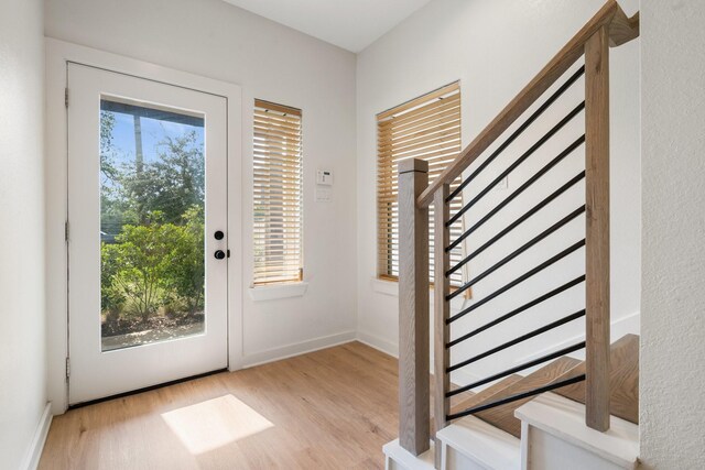 5710 Elysian St, Houston, TX 77009 - foyer with wood finished floors, stairs, and baseboards