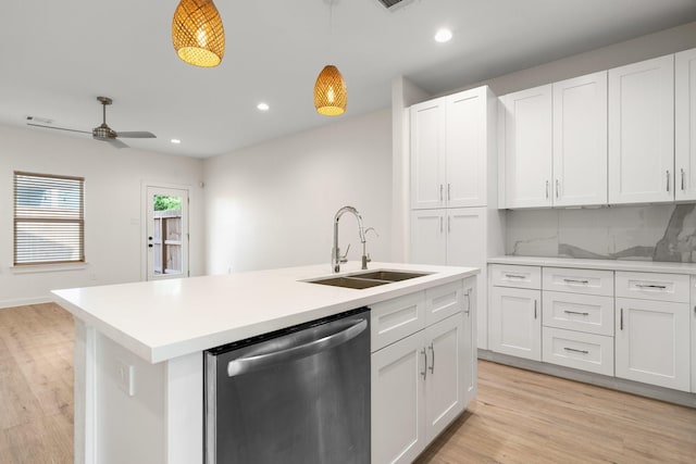 5710 Elysian St, Houston, TX 77009 - kitchen with dishwasher, a sink, white cabinetry, and recessed lighting