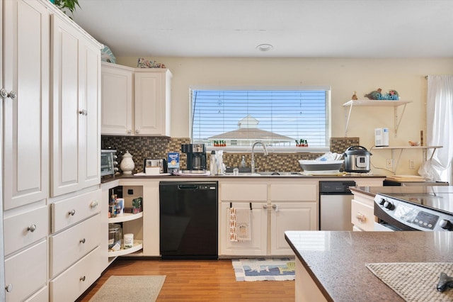 12802 Bermuda Beach Dr, Galveston, TX 77554 - kitchen featuring dishwasher, open shelves, light wood-type flooring, a sink, and backsplash