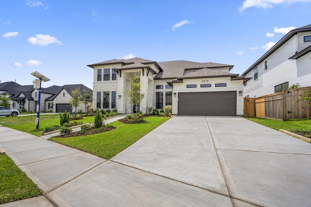 9618 Leafgate Ct, Missouri City, TX 77459 - view of front of home featuring driveway, an attached garage, a residential view, a shingled roof, and stucco siding