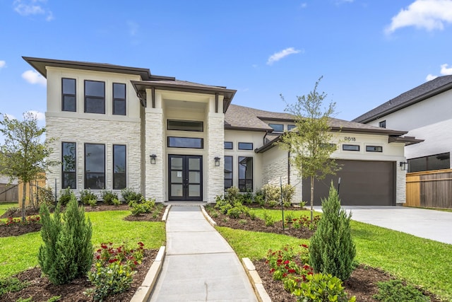 9618 Leafgate Ct, Missouri City, TX 77459 - prairie-style house with french doors, stone siding, concrete driveway, a garage, and stucco siding