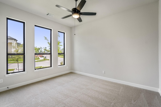 9618 Leafgate Ct, Missouri City, TX 77459 - spare room featuring baseboards, light carpet, and a ceiling fan