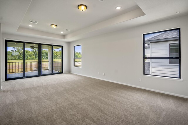 9618 Leafgate Ct, Missouri City, TX 77459 - empty room featuring a raised ceiling, baseboards, carpet flooring, and recessed lighting