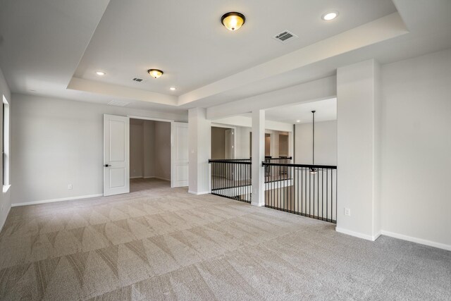 9618 Leafgate Ct, Missouri City, TX 77459 - spare room with a tray ceiling, light carpet, baseboards, and recessed lighting