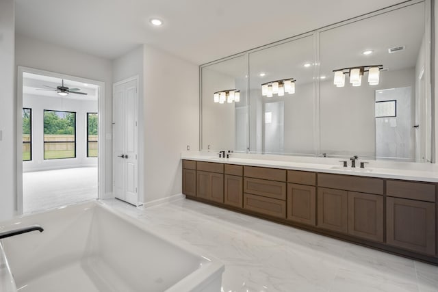 9618 Leafgate Ct, Missouri City, TX 77459 - full bathroom featuring marble finish floors, double vanity, a ceiling fan, recessed lighting, and a tub