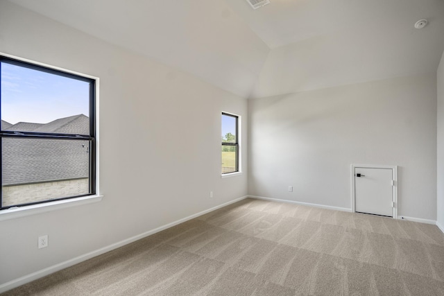 9618 Leafgate Ct, Missouri City, TX 77459 - empty room featuring vaulted ceiling, light colored carpet, and baseboards