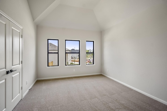 9618 Leafgate Ct, Missouri City, TX 77459 - carpeted empty room with lofted ceiling and baseboards