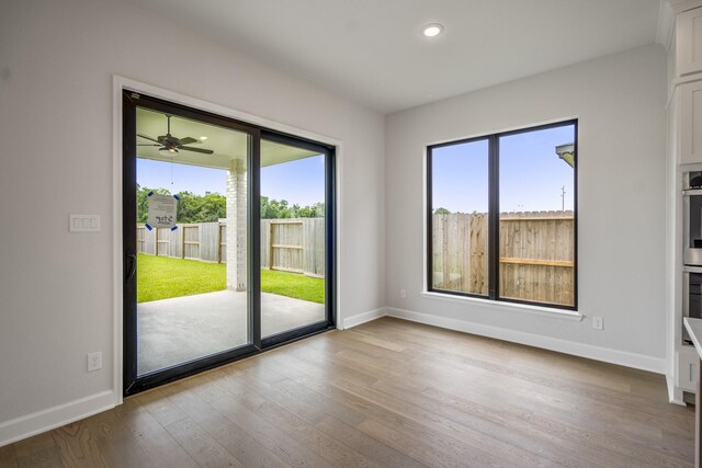 9618 Leafgate Ct, Missouri City, TX 77459 - empty room with baseboards, wood finished floors, and recessed lighting