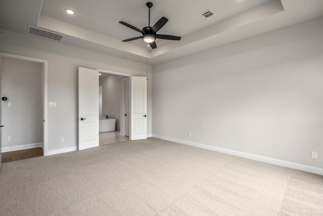 9618 Leafgate Ct, Missouri City, TX 77459 - unfurnished bedroom featuring a tray ceiling, carpet floors, baseboards, recessed lighting, and ceiling fan