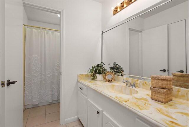 3309 Knob Hill St, Deer Park, TX 77536 - full bath featuring vanity, tile patterned flooring, baseboards, and a shower with curtain