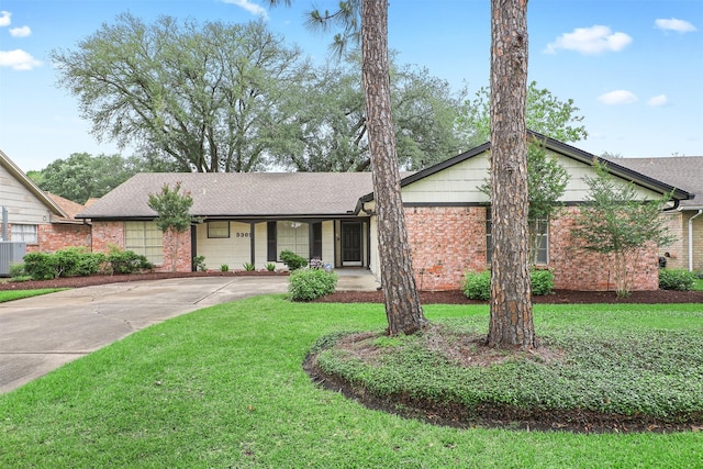 3309 Knob Hill St, Deer Park, TX 77536 - ranch-style house featuring driveway, a front lawn, central air condition unit, and brick siding
