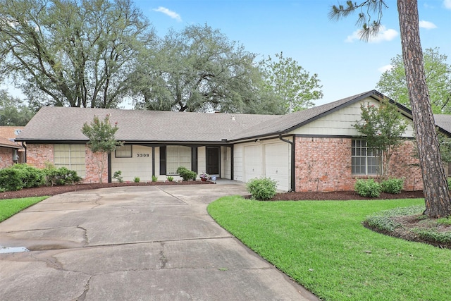 3309 Knob Hill St, Deer Park, TX 77536 - ranch-style home with brick siding, a shingled roof, a garage, driveway, and a front lawn