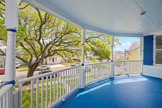 exterior space featuring covered porch and a residential view