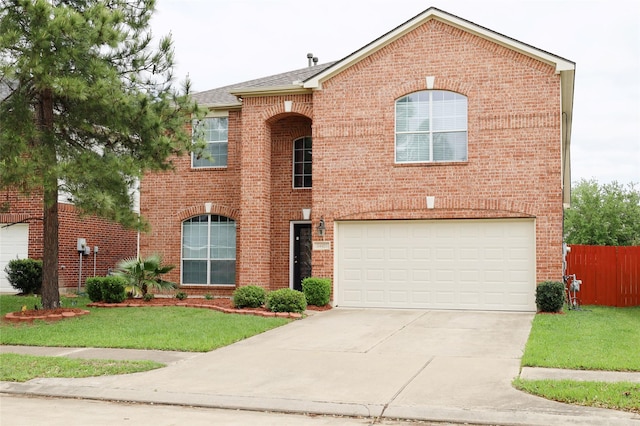 view of front of home with brick siding, an attached garage, fence, and concrete driveway