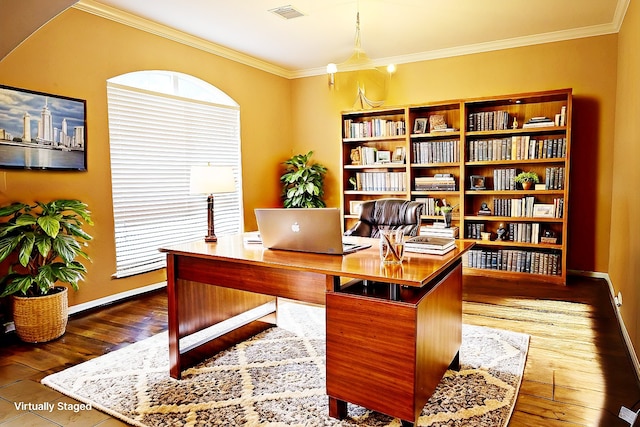 office with visible vents, baseboards, crown molding, and wood finished floors