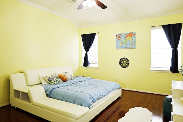 bedroom featuring visible vents, baseboards, crown molding, and wood finished floors