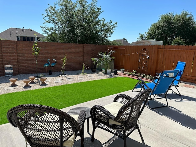 view of patio featuring a fenced backyard