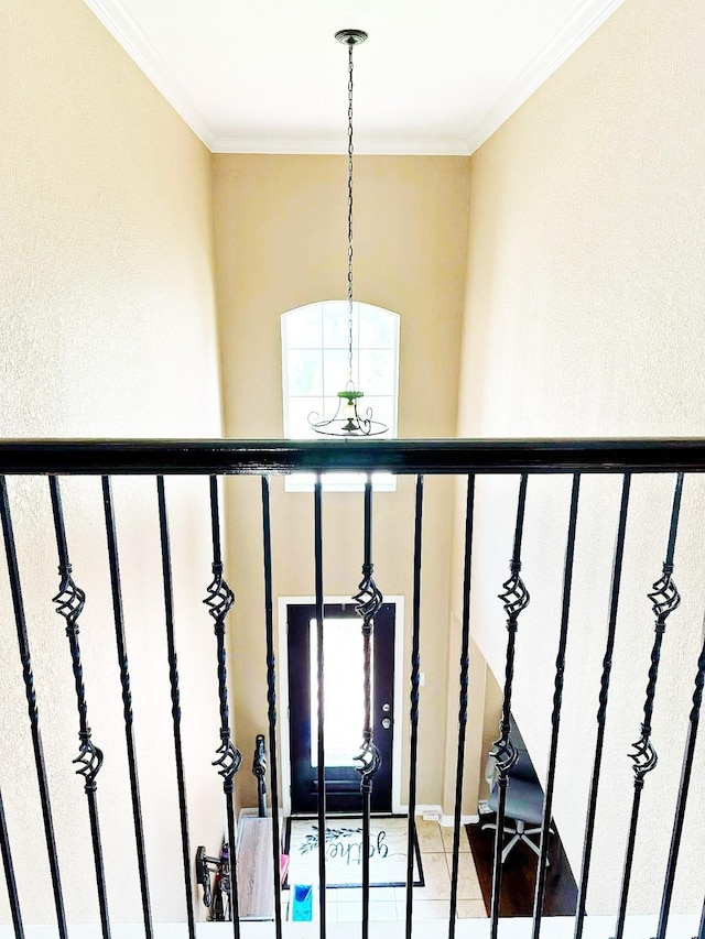 24423 Hampton Lakes Dr, Katy, TX 77493 - stairway with a chandelier, ornamental molding, and a textured wall