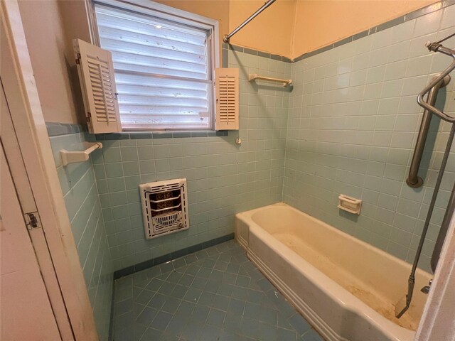105 Longridge Dr, La Marque, TX 77568 - full bathroom with shower / tub combination, tile patterned flooring, wainscoting, tile walls, and heating unit