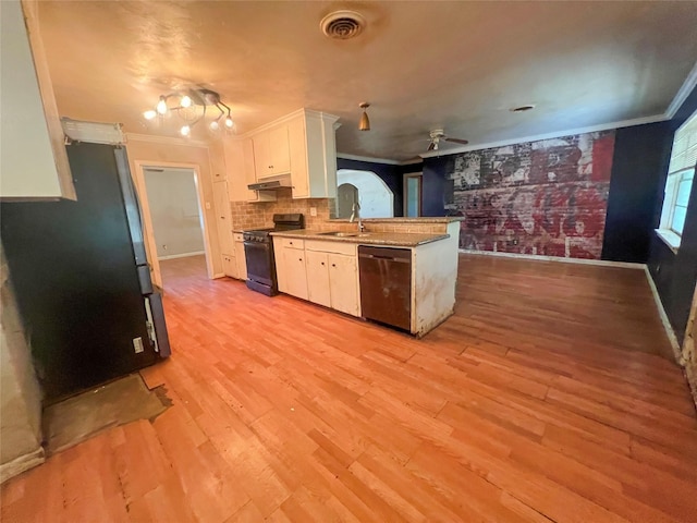 105 Longridge Dr, La Marque, TX 77568 - kitchen with a peninsula, ornamental molding, visible vents, black appliances, and under cabinet range hood