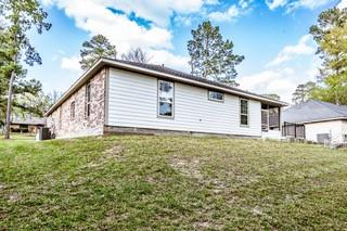 back of house featuring a yard