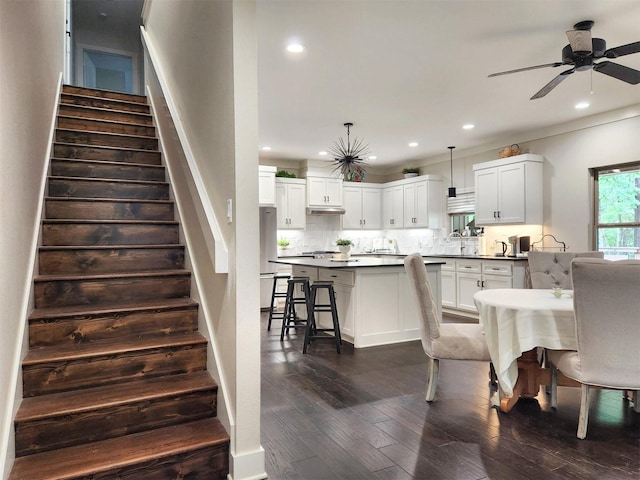 22624 County Road 1174, Bullard, TX 75757 - dining area featuring dark wood-type flooring, ceiling fan, recessed lighting, and stairway