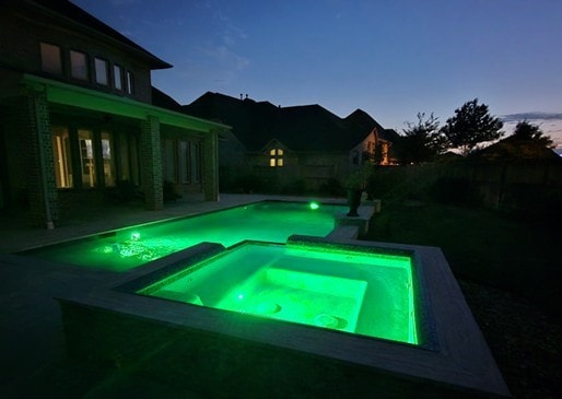 7106 Prairie Grass Ln, Katy, TX 77493 - view of swimming pool featuring a pool with connected hot tub and a fenced backyard