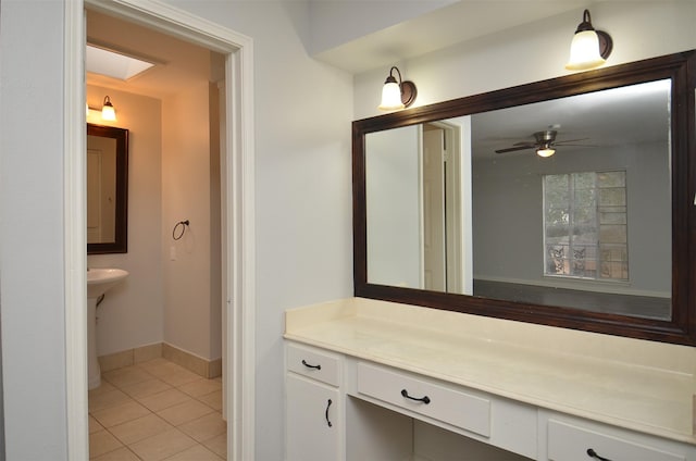 bathroom featuring tile patterned floors, ceiling fan, and baseboards