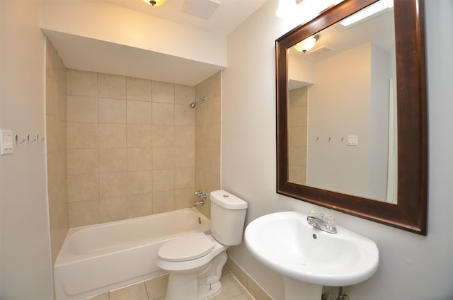 full bathroom with visible vents, a sink, toilet, tub / shower combination, and tile patterned floors