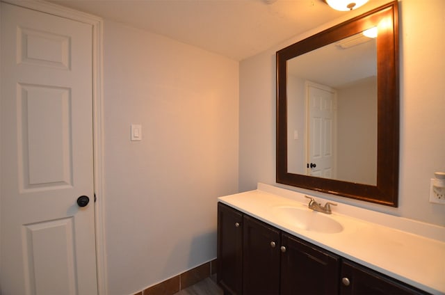 bathroom with vanity and baseboards