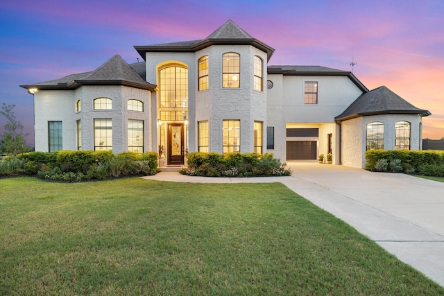 26719 Outback Dr, Katy, TX 77493 - french country style house with a front yard, driveway, and an attached garage