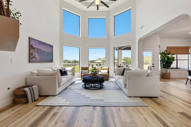 26719 Outback Dr, Katy, TX 77493 - living room featuring baseboards, a ceiling fan, and wood finished floors