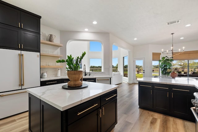 26719 Outback Dr, Katy, TX 77493 - kitchen with recessed lighting, visible vents, dark cabinetry, and appliances with stainless steel finishes