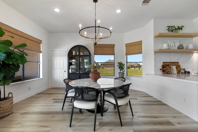 26719 Outback Dr, Katy, TX 77493 - dining space featuring visible vents, baseboards, a notable chandelier, light wood-type flooring, and recessed lighting