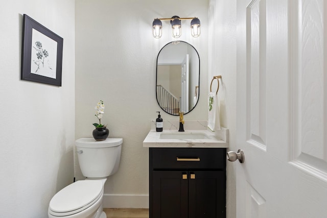26719 Outback Dr, Katy, TX 77493 - half bathroom featuring vanity, baseboards, and toilet
