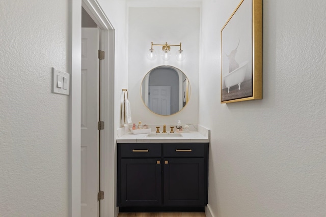 26719 Outback Dr, Katy, TX 77493 - bathroom with a textured wall and vanity